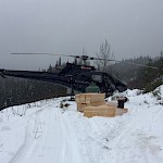 Helicopter moving supplies, Phase One Drilling